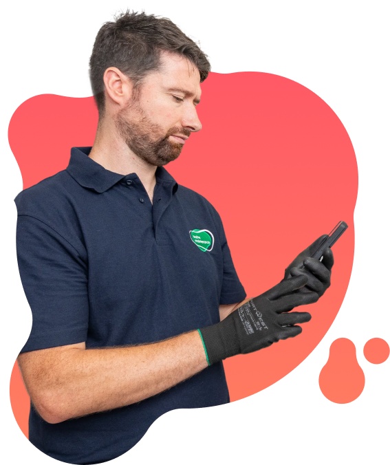 Person wearing protective gloves using a handheld device, with Insite Maintenance branding visible on their clothing.