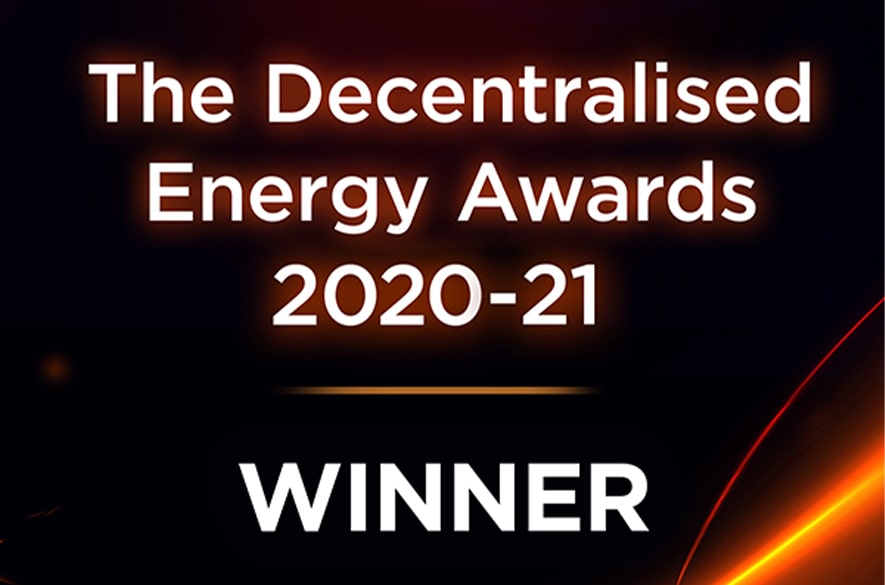Graphic displaying the text “The Decentralised Energy Awards 2020–21” and “WINNER” in large white lettering on a dark background with orange and red abstract light streaks.
