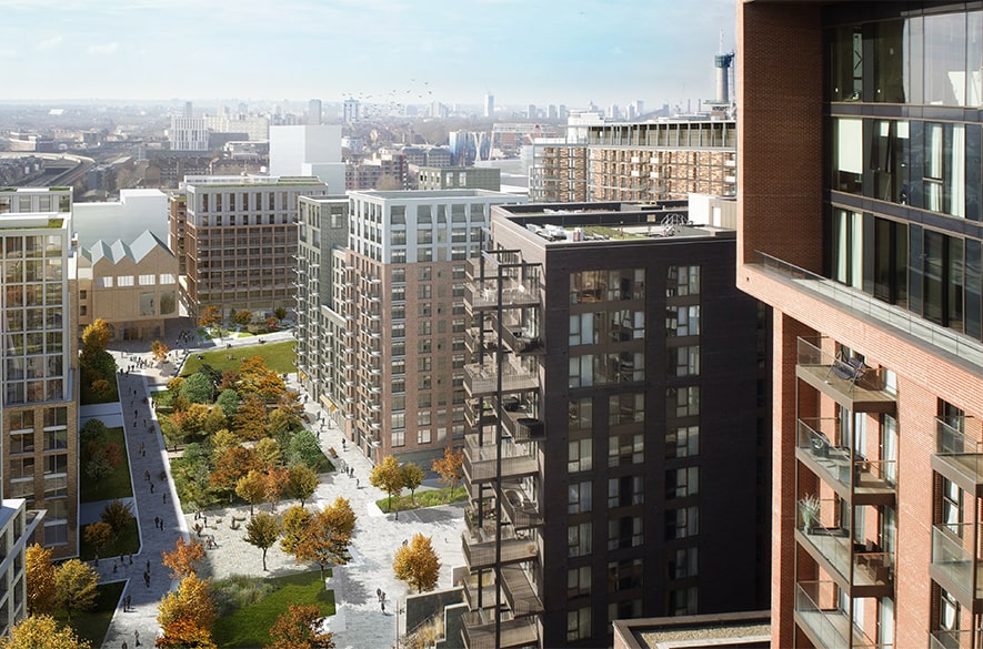 Computer‑generated image of the Nine Elms redevelopment on the former Royal Mail site, showing mid‑ and high‑rise residential buildings arranged around a long landscaped public walkway with trees, paved paths, and open green spaces. Balconies and façades of surrounding apartment blocks overlook the central route, with the wider London skyline visible in the distance.