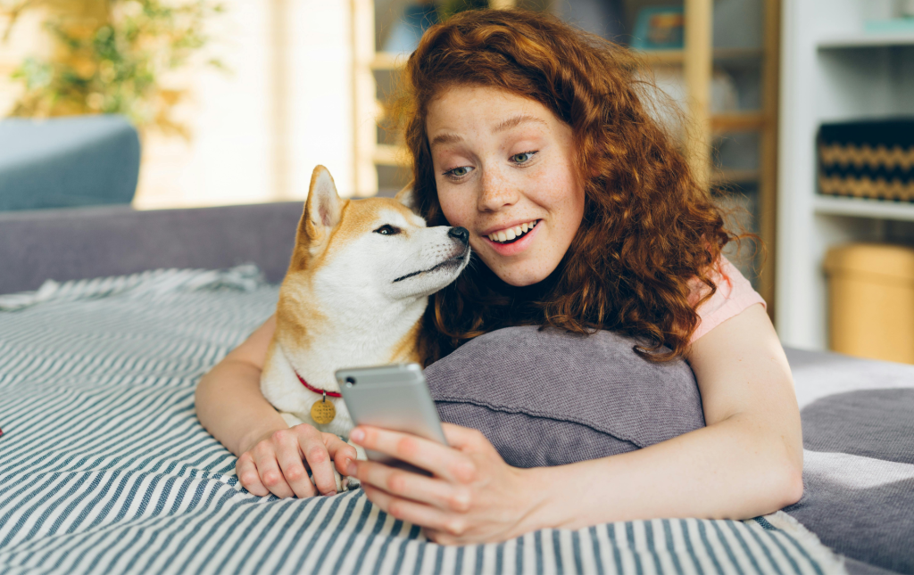 A resident with their dog reading the Insite resident newsletter