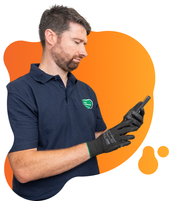 Person wearing protective gloves using a handheld device, with Insite Maintenance branding visible on their clothing.
