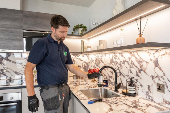 Engineer performing water quality testing on a heat network system to ensure compliance and efficiency