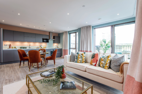 Modern open-plan apartment at The Lock, Greenford Quay featuring a contemporary kitchen, dining area, living space and floor-to-ceiling windows.