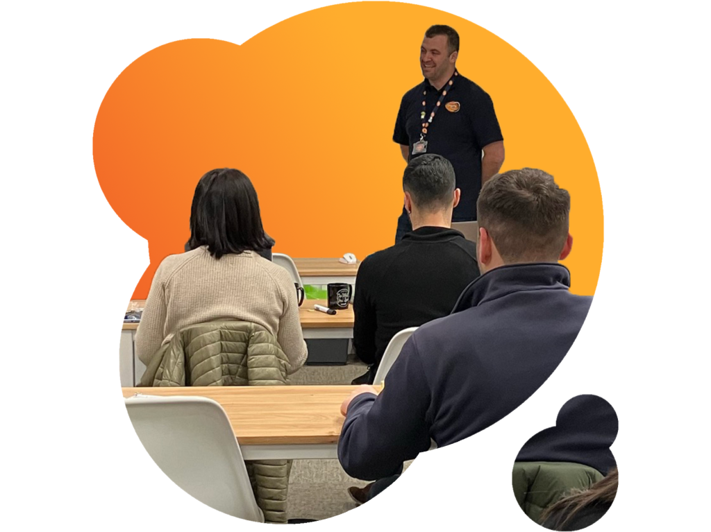 A group of property managers are learning about heat network metering & billing, presented by Insite's Solutions Manager,